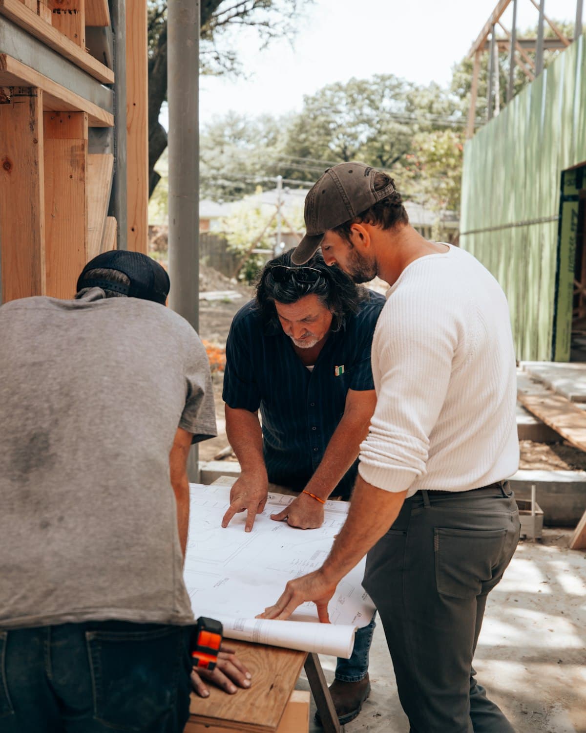 Construction workers reviewing plans